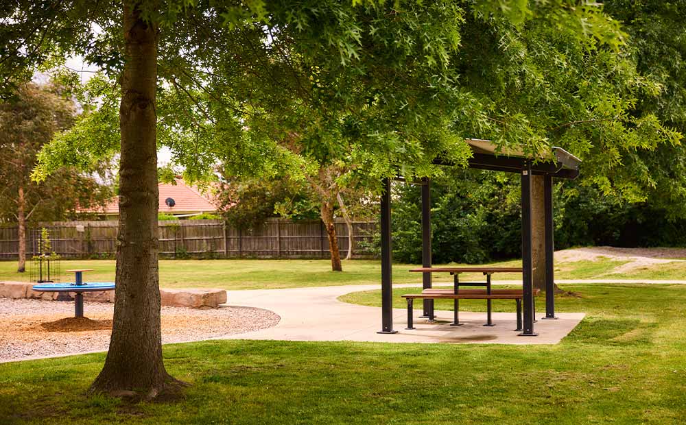 Playground surrounded by mature trees